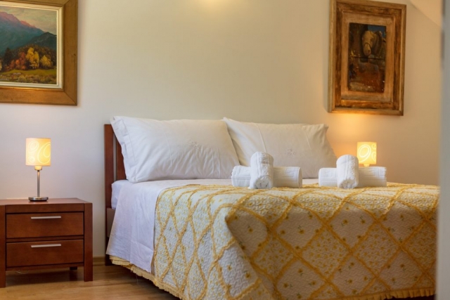 Comfortable bed in the sleeping room of Villa Roglic
